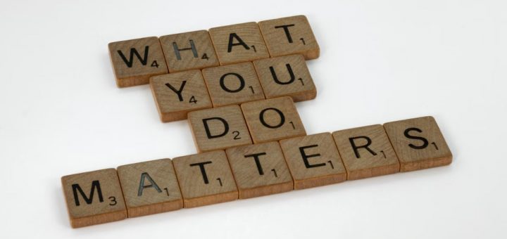 Wooden letter tiles spelling 'What You Do Matters' on a neutral background.